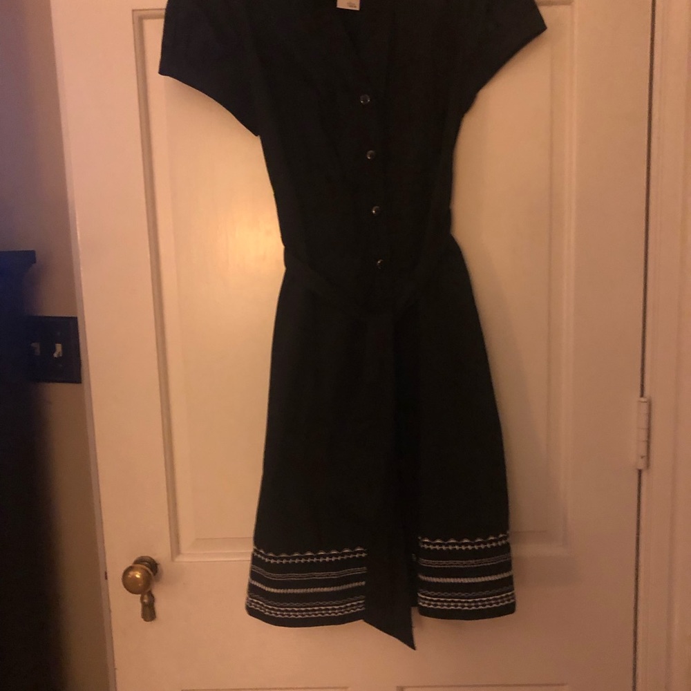 Black dress with embroidered hem in white. NWT